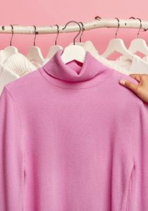 Dry cleaning of soft pink turtleneck sweater